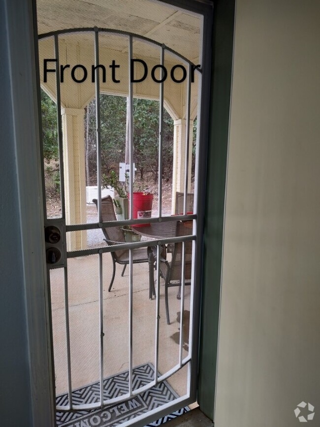 Main entrance showing Covered patio w table and chairs - 6588 Log Cabin Ln