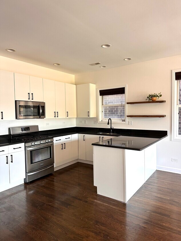 Updated kitchen with SS appliances, floating shelves - 3103 W Armitage Ave