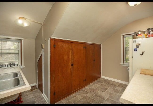 Kitchenette area with compact storage area - 1126 7th Ave SE