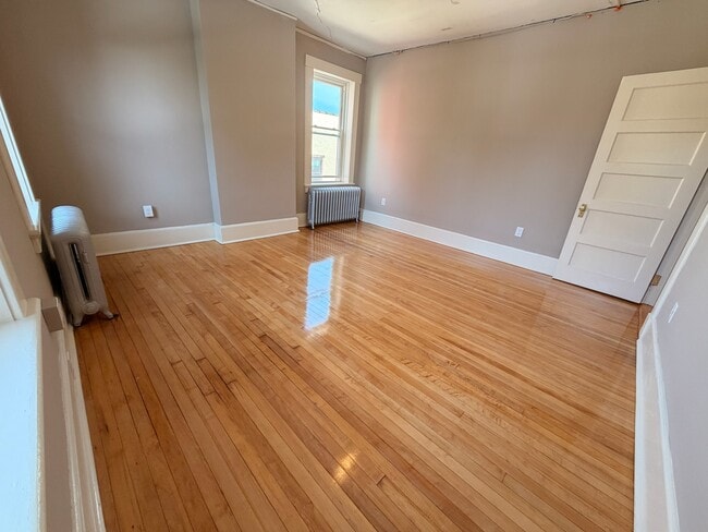 large bedrooms with hardwood floors - 69 S Pleasant St