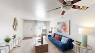 Located at 800 Custer Rd in Richardson, TX, this single-story 2-bedroom, 2-bathroom residence offers a thoughtfully designed layout that maximizes comfort and functionality. The living room serves as the heart of the home, featuring plush carpeting, a ceiling fan with light fixture, and large windows dressed with patterned curtains that invite generous natural light. The space flows seamlessly into a dedicated dining area, which also benefits from a window and an overhead pendant light. The galley-style kitchen is equipped with white cabinetry, granite-look countertops, a double-basin sink, hardwood-style flooring, and black appliances, with an open pass-through view into the living area. The primary bedroom is a comfortable retreat with carpet flooring, a ceiling fan, a window with outdoor views, and direct access to a closet. The second bedroom mirrors this comfortable style, also featuring carpet, a ceiling fan, and a window with natural light. Both bathrooms include a tub-shower combination with white tile surround. Three closets throughout the home provide ample storage. The overall ambiance is bright, neutral, and inviting, making this a practical and comfortable Richardson residence.