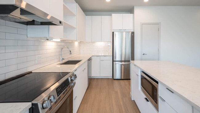 Kitchen with Stainless Steel Appliances - The Basin