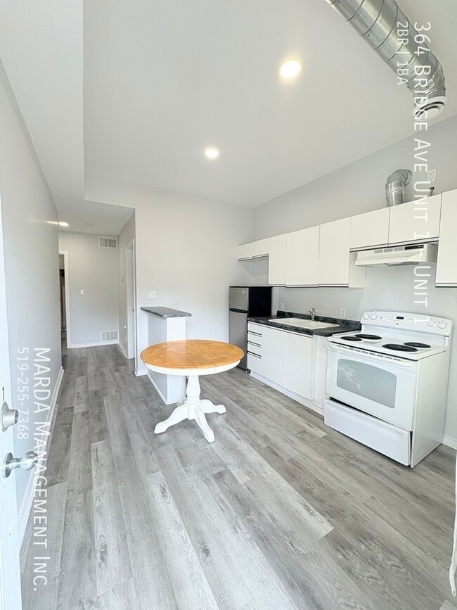 Building Photo - 2 BEDROOM 1 BATH MAIN FLOOR UNIT - ALL UTI...