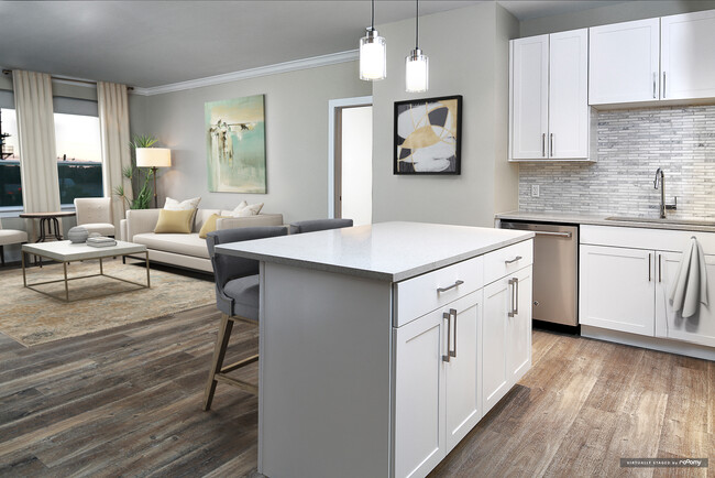 Signature Collection kitchen and living room with hard surface flooring - Avalon Rockville Centre