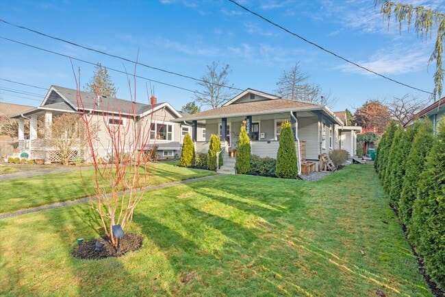 large, west facing front yard - 8042 Earl Ave NW