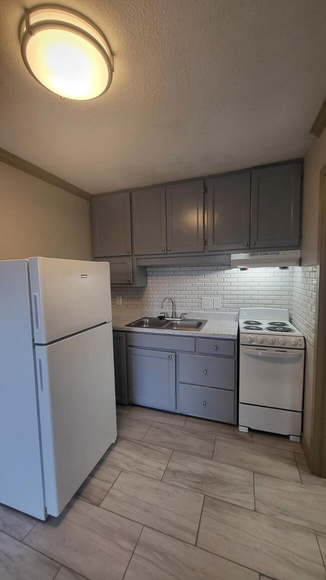 STUDIO KITCHEN - Commerce Village Apartments Phase II