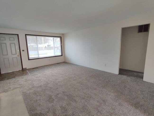 Building Photo - Duplex with garage and fenced yard and upd...