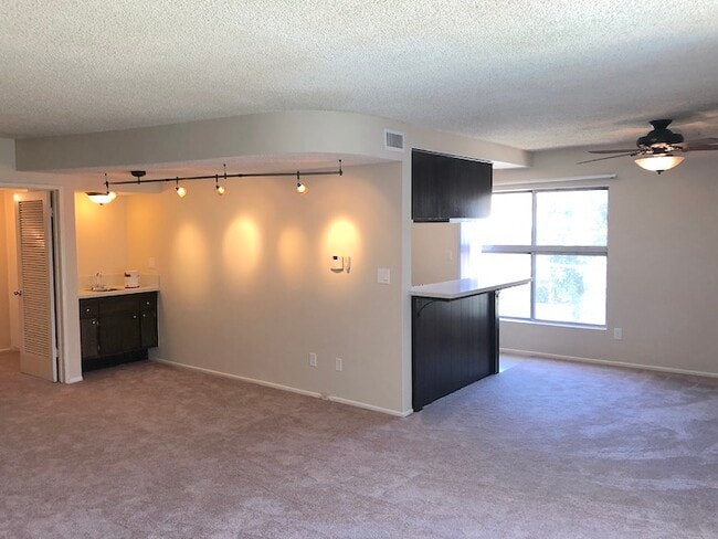 Living room, dining area, with breakfast bar and wet bar - 11168 Acama St