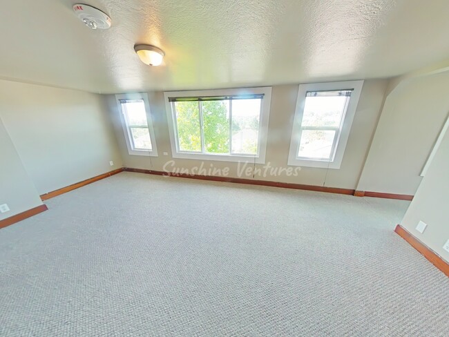 8 Living Room Wall of Windows - The Highland at 936