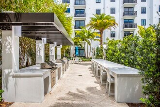 Outdoor grilling stations and dining areas make entertaining effortless. - SoLe Mia Rentals