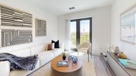 This contemporary 520 square foot apartment in Tampa, FL, offers a harmonious blend of style and functionality. The open-concept layout maximizes the use of space, creating a seamless flow between the living areas. The kitchen boasts sleek wooden cabinetry, stainless steel appliances, and granite countertops, perfect for culinary enthusiasts.

The living room is bathed in natural light from floor-to-ceiling windows, which lead to a private balcony offering city views. Modern artwork and geometric patterns add visual interest to the crisp white walls. The 150 square foot bedroom features a large window, ample storage, and soothing neutral tones, creating a tranquil retreat.

The bathroom showcases a modern design with a granite vanity, large mirror, and a combination shower/tub. Throughout the apartment, light wood-look flooring enhances the bright and airy ambiance. Track lighting in the kitchen and recessed lighting in other areas provide ample illumination.

This well-designed space efficiently accommodates all the essentials of modern living, making it an ideal urban dwelling for singles or couples seeking a stylish and low-maintenance lifestyle in the heart of Tampa.