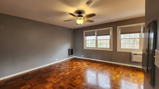 Building Photo - Spacious and Bright End Unit in Park-like Setting