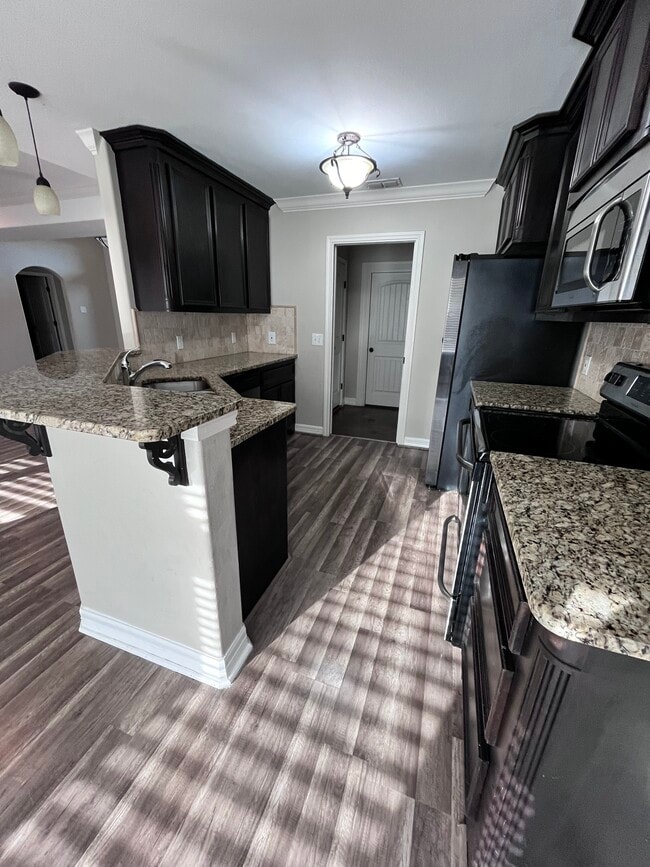 Spacious kitchen with stainless appliances - 7213 Lake Serenity Dr