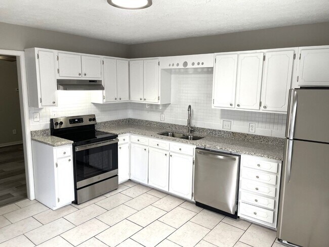 Building Photo - Corner unit, parking for 2 cars, LVP floor...