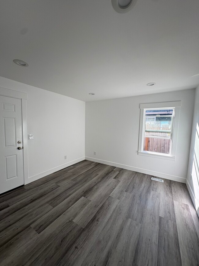 Master bedroom with closet and door to the back yard. - 1435 S 128th St
