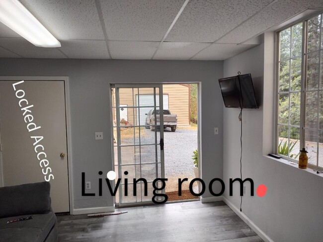 Sliding door and a main door w security screen. - 6588 Log Cabin Ln