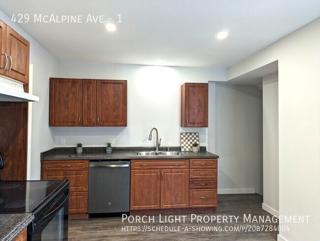 Building Photo - Main Floor With Parking, Laundry, Yard and Plenty of Storage