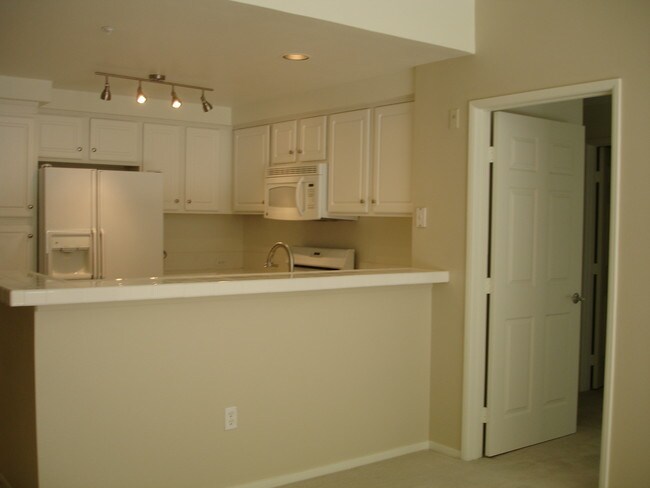 Kitchen from Dining Area - 300 Caldecott Ln