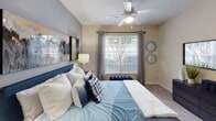 Located at 213 Rocky Ridge Blvd in Douglasville, Georgia, this single-floor residence offers a thoughtfully designed layout with a cohesive modern aesthetic throughout. The living room serves as the centerpiece of the space, featuring a striking deep teal accent wall, wood-style flooring, and a ceiling fan. French doors invite natural light and provide outdoor access, creating an open, airy atmosphere. The living area flows seamlessly into a dedicated dining space, with a clear sightline connecting to the bedrooms beyond.

The kitchen is well-equipped with white cabinetry, stone-look countertops, a subway tile backsplash, and black appliances including a refrigerator, range, and microwave. A peninsula with bar seating offers a practical and social casual dining option.

The bedrooms are carpeted and generously sized, each featuring ceiling fans or ample lighting, large windows that bring in natural light, and access to closet space. One bedroom highlights a vaulted ceiling detail and a bold teal accent wall, adding a dramatic, cozy feel. The bathroom features wood-style flooring, white vanity cabinetry, a large mirror, and a shower-tub combination. Neutral wall tones throughout provide a versatile backdrop that complements the home's contemporary design elements.