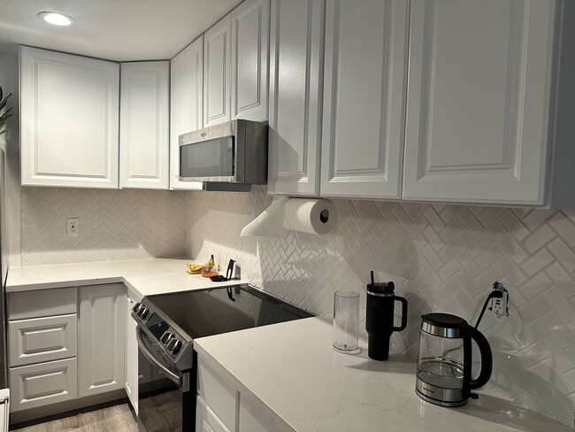 Microwave and stove - 1800 E Heim Ave