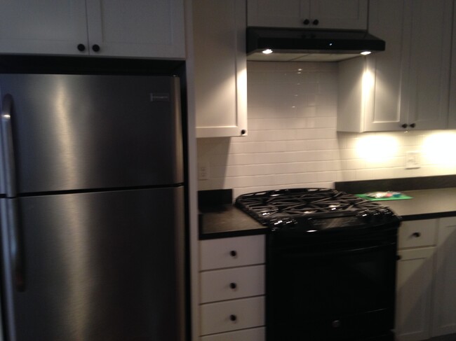 Kitchen with 5 burner gas rang and convection oven. - 239 Kentucky Ave