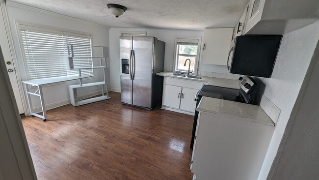 Kitchen refreshed cabinets - 203 Johnson St