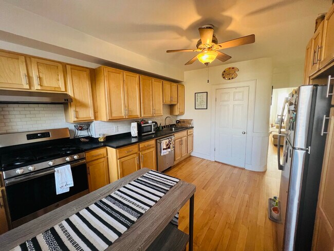 Kitchen with modern stainless steel appliances and dishwasher - 82 Webster St