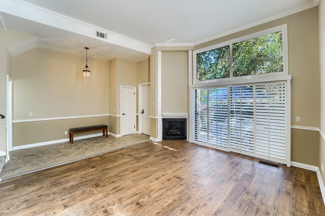 Livingroom towards front door, closet and patio - 6256 Shoup Ave