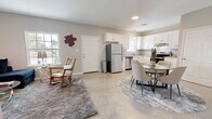 Located at 187 Venable Ln in Monroe, Louisiana, this well-designed single-story home offers a comfortable and functional layout across one bedroom and one bathroom. The open-concept main living area seamlessly connects the kitchen, dining, and living spaces, creating an inviting and efficient flow throughout.

The kitchen is outfitted with crisp white shaker-style cabinetry, granite countertops, and a full suite of stainless steel appliances, including a refrigerator, dishwasher, and electric range. A window above the sink brings in natural light, enhancing the clean, bright aesthetic. Polished concrete floors extend throughout the main living area, lending a modern, low-maintenance character to the space.

The living room is a comfortable retreat featuring a ceiling fan, large windows for natural light, and ample room for relaxed seating arrangements. The bedroom offers a cozy atmosphere with warm neutral tones, carpeted flooring, and two closets providing generous storage.

The bathroom is finished with a white vanity, granite countertop, a well-lit mirror, and a tub-shower combination, maintaining the consistent, clean design language found throughout the home. Neutral wall tones and thoughtful finishes tie each room together, creating a cohesive and welcoming living environment.