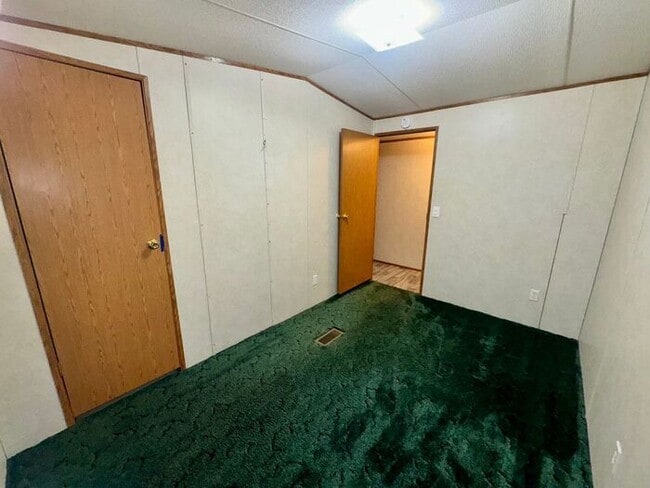 Building Photo - Three bedroom two bath Castleberry manufactured home with a screen porch and carport!