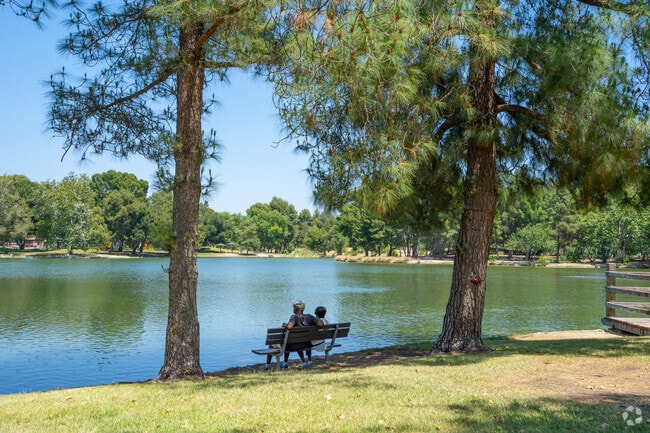 Anaheim residents can relax on a bench by the lake at Yorba Regional Park.