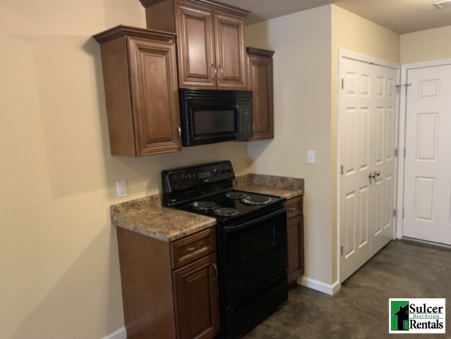 Building Photo - The Oaks - Water &amp; Sewer Included