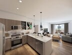 This contemporary 1-bedroom apartment in Redmond, WA offers 520 square feet of efficiently designed living space. The open-concept layout seamlessly blends the living room and kitchen, creating a spacious feel. Large windows flood the area with natural light and provide city views, enhancing the sense of openness.

The sleek kitchen boasts modern appliances, including a stainless steel refrigerator and built-in microwave. White quartz countertops contrast beautifully with the wood-toned cabinetry, while pendant lighting adds a stylish touch. The living area features wood-look flooring and ample space for furniture arrangement.

The bedroom, measuring 120 square feet, includes a ceiling fan and continues the wood flooring theme. A generous closet with double doors provides storage space. The bathroom showcases a contemporary design with a large vanity, wood cabinets, and a combination tub-shower with elegant black fixtures.

Throughout the apartment, clean white walls and minimal design elements create a fresh, modern aesthetic. The property's location at 16855 Redmond Way places residents in the heart of Redmond, offering urban convenience in a compact, well-designed living space.