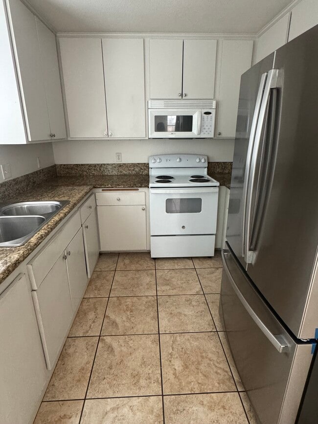 Stainless steel fridge - 1031 S Mollison Ave