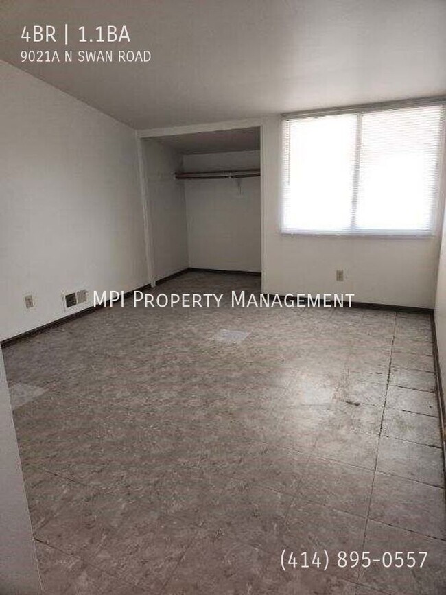 Building Photo - 9021 N Swan Rd
