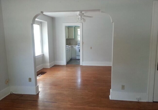 Living room (dining room and kitchen seen through doorways) - 100 Highland Dr