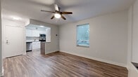 Located at 910 Pennsylvania Ave in Kansas City, MO, this one-bedroom unit offers a practical and well-appointed layout across a single floor. The combined kitchen and living area forms the heart of the space, featuring rich hardwood-style flooring, neutral gray walls, and a ceiling fan with integrated lighting that adds both function and a finishing touch. Multiple windows allow natural light to filter in, creating a bright and welcoming atmosphere.

The kitchen is thoughtfully designed with white cabinetry extending to the ceiling, a classic subway tile backsplash, and a full suite of stainless steel appliances including a dishwasher, range, and over-the-range microwave. A small island or peninsula provides additional counter space and a natural boundary between the kitchen and living area.

The bedroom is carpeted for comfort and includes a built-in closet with shelving and hanging rods, offering organized storage. A window with blinds brings in natural light while maintaining privacy. The room is a comfortable size, well-suited for a full bedroom setup.

Overall, this unit presents a clean, modern aesthetic with updated finishes throughout, making efficient use of its footprint while delivering a functional and livable environment in the heart of Kansas City.
