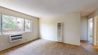 Located on Julian Ave in Lakeside, CA, this single-story, 3-bedroom, 1-bathroom home offers a straightforward and functional layout. The interior is finished with wall-to-wall carpet throughout the living and bedroom areas, complemented by neutral, light-toned walls and textured ceilings that create a clean, consistent aesthetic.

The spacious primary bedroom includes a ceiling fan, a window with outdoor views of surrounding greenery, and a wall-mounted heater unit. The additional two bedrooms are well-proportioned — one features a sliding closet with a hanging rod, and both are served by natural light through standard windows. Each room maintains a calm, understated character.

The kitchen is efficiently designed in an L-shaped layout with white cabinetry offering ample storage, white appliances including a gas range and refrigerator, a double-basin sink, and a window that lets in natural light. The tile flooring in the kitchen provides a durable, easy-to-maintain surface.

The bathroom includes a vanity with white cabinetry and a countertop sink, a wall-mounted mirror, and tile flooring. The overall layout of the home promotes ease of flow between rooms. Wall-mounted heating units are present in multiple rooms, ensuring climate comfort throughout. The home's neutral finishes offer a versatile backdrop suitable for a variety of furnishing styles.