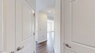 Located at 330 Jacksonville Road in Warminster, PA, this one-bedroom, one-bathroom unit offers a well-organized single-floor layout designed for comfortable everyday living. The combined kitchen and living area serves as the heart of the home, with warm hardwood-style flooring flowing throughout the main living space. Large windows and a glass-paneled door flood the living room with natural light while providing access to a private balcony with views of the surrounding community. The kitchen is functionally appointed with rich, dark-stained wood cabinetry, granite-style countertops, stainless steel appliances including a range, microwave, and refrigerator, and light ceramic tile flooring. A breakfast bar connects the kitchen to the living area, enhancing the open feel. The bedroom is a comfortable retreat featuring plush carpeting, multiple windows with neighborhood views, and a double-door closet offering generous storage. A hallway connects the main areas to the full bathroom, which includes a wood-vanity with a light countertop, tile flooring, and chrome fixtures. Clean white walls and neutral tones throughout create a bright, move-in-ready atmosphere suited for a range of lifestyles.