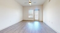 This contemporary 1060 square foot apartment in Kissimmee, Florida offers a blend of comfort and style. The open-concept layout maximizes the living space, creating a seamless flow between the kitchen and living areas. The kitchen is a highlight, featuring crisp white cabinetry, granite countertops, and stainless steel appliances, including a side-by-side refrigerator and over-the-range microwave. Subway tile backsplash adds a modern touch.

Both bedrooms are generously sized, with the primary bedroom measuring 160 square feet. Plush carpeting in the bedrooms provides comfort underfoot, while the living areas boast durable wood-look flooring. Large windows in the bedrooms and living room allow ample natural light, with blinds for privacy control. Ceiling fans enhance air circulation.

The two bathrooms feature modern fixtures, including granite vanity tops and ample storage. A dedicated laundry room with full-sized washer and dryer adds convenience. Walk-in closets offer generous storage solutions.

The apartment's neutral color palette creates a bright, airy ambiance throughout, providing a blank canvas for personal decorating styles. This well-designed space combines functionality with contemporary aesthetics, ideal for modern living.