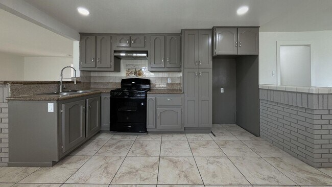 Building Photo - PRICE REDUCTION! Spanish Style 3 Bedroom 2...