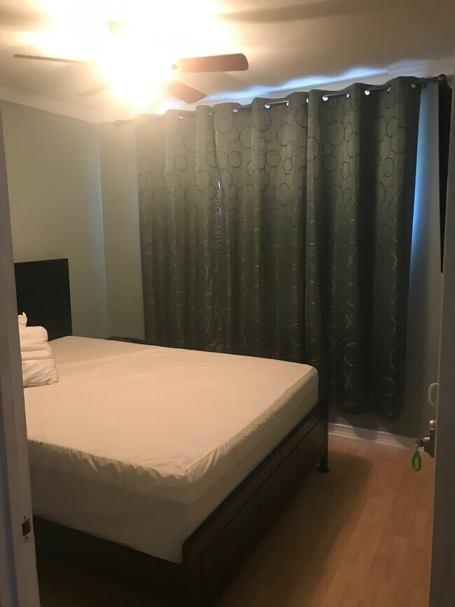 Queen bed with laundered mattress protector - 760 Wainee St
