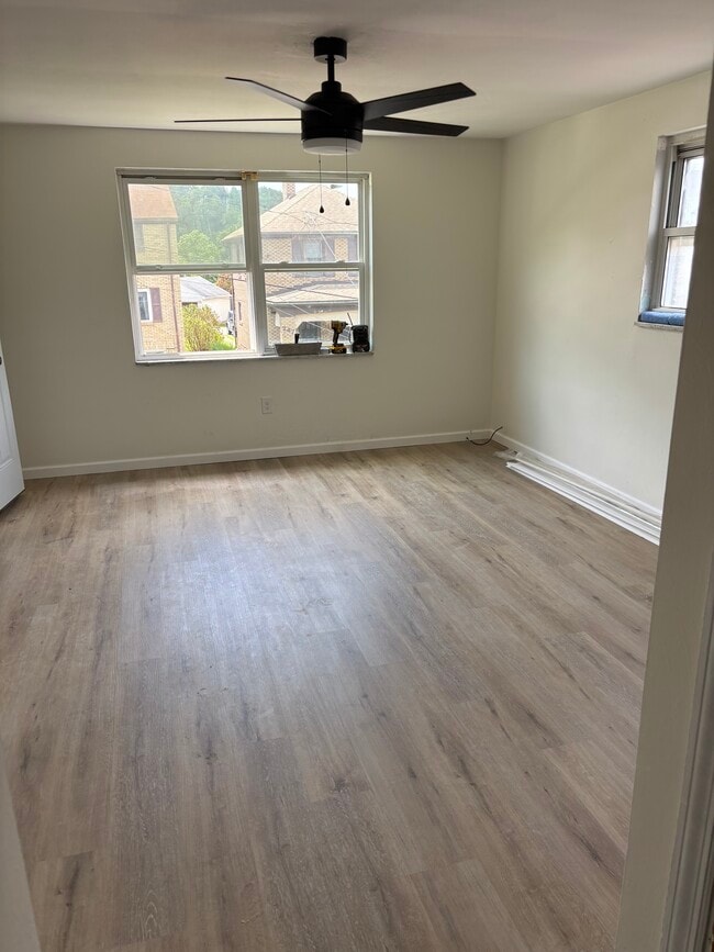 Living room with new LVT flooring - 244 Clairmont Ave