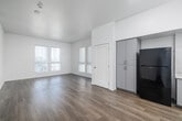 Located at 2444 Barry Ave in the desirable West Los Angeles neighborhood of Mar Vista, this 3-bedroom, 1-bathroom single-floor home offers a clean, modern aesthetic throughout. The interior is defined by crisp white walls, light hardwood-style flooring, and an abundance of natural light streaming through large windows fitted with vertical blinds.

The open-concept kitchen and living area serves as the heart of the home, featuring gray cabinetry, white countertops, a black refrigerator and range, and recessed lighting above — all set against warm wood-toned floors that extend seamlessly into the living space.

The generously sized primary bedroom is bathed in natural light from multiple large windows offering views of the surrounding Los Angeles skyline and treetops. Each of the three bedrooms includes sliding closet doors, contributing to a total of four closet spaces throughout the home. The additional bedrooms are bright and well-proportioned, each with their own window bringing in natural light.

The bathroom features a clean, white tile surround with a combined soaking tub and shower. A hallway connects the rooms efficiently, and the overall layout — as seen in the dollhouse view — provides a practical, well-organized flow throughout this bright and contemporary Los Angeles home.