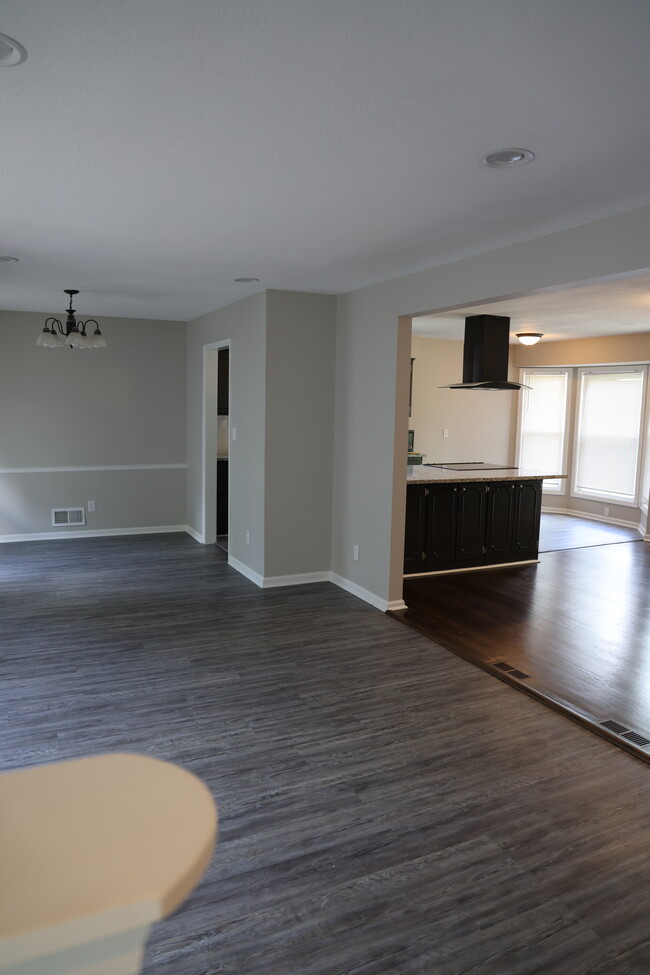 Family room open to kitchen/dining area - 8404 E 104th Ter