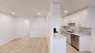 Located at 910 Camino Pescadero in Goleta, CA, this thoughtfully designed one-bedroom, one-bathroom unit offers a clean, modern aesthetic across a single floor. Light wood-look flooring flows seamlessly throughout, creating a warm and cohesive feel in every room.

The open living area greets you upon entry, featuring a classic paneled front door with an arched transom window and multiple windows fitted with horizontal blinds, allowing ample natural light to fill the space. Recessed lighting and baseboard heating add both functionality and comfort.

The galley-style kitchen is a standout feature, showcasing floor-to-ceiling white cabinetry, striking marble-veined countertops and backsplash, stainless steel appliances including a gas range and dishwasher, and a double-basin sink — all combining to create a sleek, contemporary cooking space.

The bedroom is a comfortable, well-proportioned retreat with recessed lighting, a window offering pleasant outdoor greenery views, baseboard heating, and a large double sliding closet with classic six-panel doors for generous storage.

The bathroom is elegantly appointed with full marble-style tile surrounding the walk-in glass shower, a white vanity with marble countertop, and wood-look tile flooring, delivering a refined, spa-like atmosphere. A hallway connects the spaces efficiently, completing this well-appointed home.