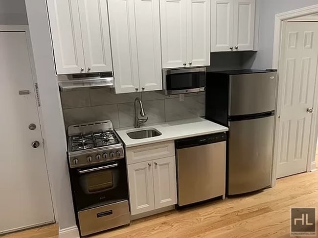 Building Photo - Modern 3BR in the Heart of the East Village – In-Unit W/D & Dishwasher!