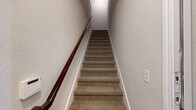 This well-designed home in Rockwall, TX offers 1450 square feet of living space across two floors. The property boasts 3 bedrooms and 3 bathrooms, providing ample space for comfortable family living. The primary bedroom is generously sized at 180 square feet, ensuring a luxurious retreat for homeowners.

The interior showcases a blend of carpeted and hardwood flooring, with the living areas featuring gleaming wood floors that add warmth and elegance. Crown molding adorns the ceilings, enhancing the overall aesthetic. Large windows with blinds allow for plenty of natural light and privacy control.

The kitchen is a highlight, featuring rich cherry-wood cabinetry, granite countertops, and modern stainless steel appliances. A central island provides additional workspace and casual seating. The open-concept design seamlessly connects the kitchen to the living and dining areas, perfect for entertaining.

Bathrooms are well-appointed with tile flooring, granite vanities, and updated fixtures. The home includes practical amenities such as a laundry room and an attached garage. Multiple closets, including walk-ins, offer abundant storage throughout.

Ceiling fans in bedrooms provide comfort, while recessed lighting and stylish fixtures illuminate the space. The neutral color palette allows for easy personalization. With its thoughtful layout and quality finishes, this home presents a turnkey opportunity in a desirable Rockwall location.