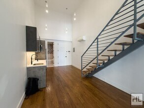 Building Photo - Stunning Two-Bedroom Duplex with Soaring 1...
