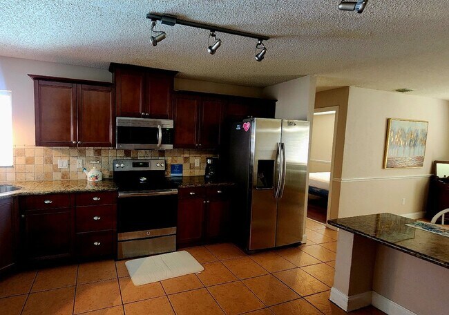 Foto del edificio - The Woodlands of Palm Coast- FURNISHED- 4 Bedroom 2 Bath- Long Term